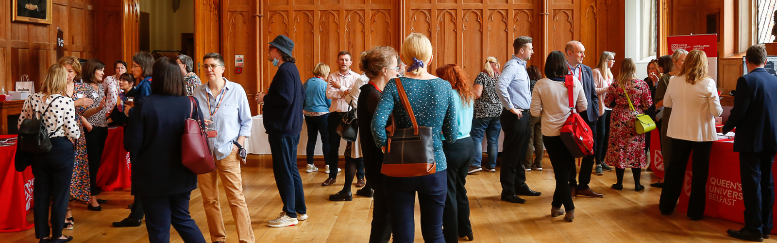 Image shows staff gathered at an event in the Great Hall.